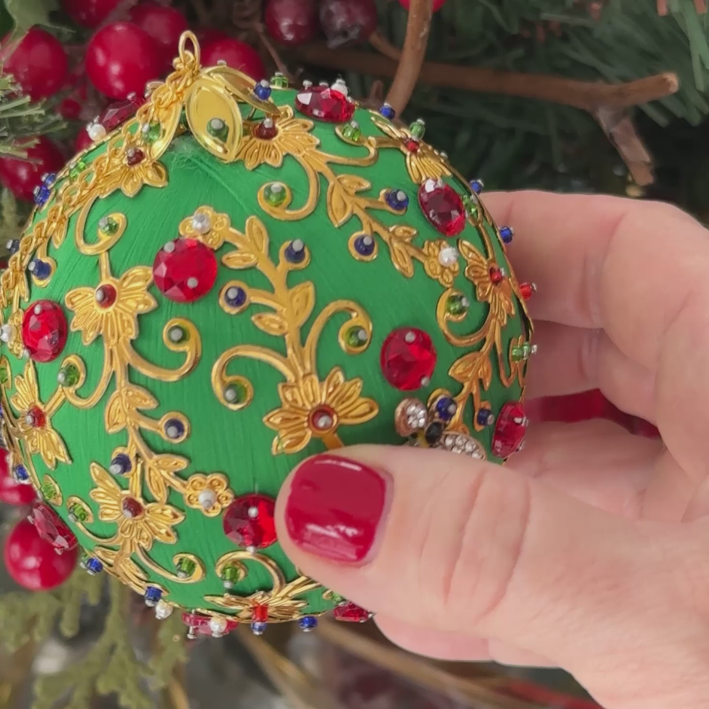 Video of Quam Handmade Ornament by Whim5seasons, featuring gold, green, and red colors in front of Christmas decor.  (Green)