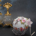 Load image into Gallery viewer, Top Pearly flower on handmade Easter Egg Push Pin Ornament  by Whim5seasons - white satin egg with pink plum bloom embroidery patches and silver cording. (White)
