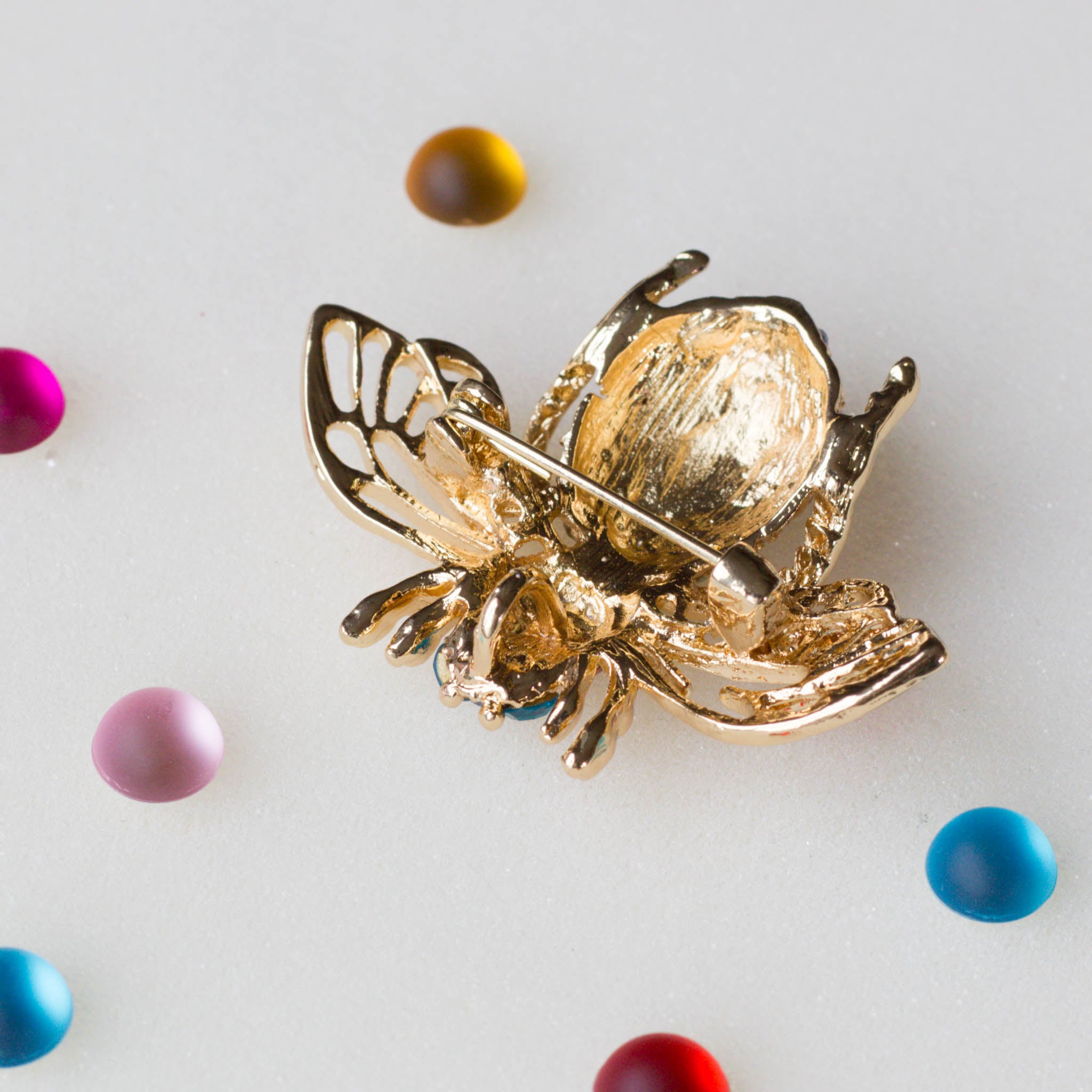The back of a Bee brooch, approximately 2" by 2". Versatile embellishment for a garment, handbag, or a large ornament from Whim5seasons.