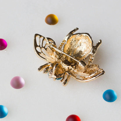 Bee brooch with a ruler, approximately 2" by 2". Versatile embellishment for a garment, handbag, or a large ornament from Whim5seasons.