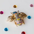 Load image into Gallery viewer, This is a Bee brooch, approximately 2" by 2". Versatile embellishment for a garment, handbag, or a large ornament.
