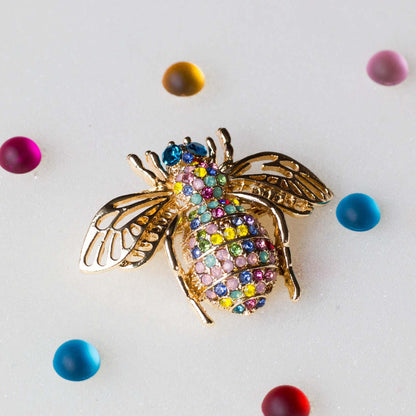 This is a Bee brooch, approximately 2" by 2". Versatile embellishment for a garment, handbag, or a large ornament.