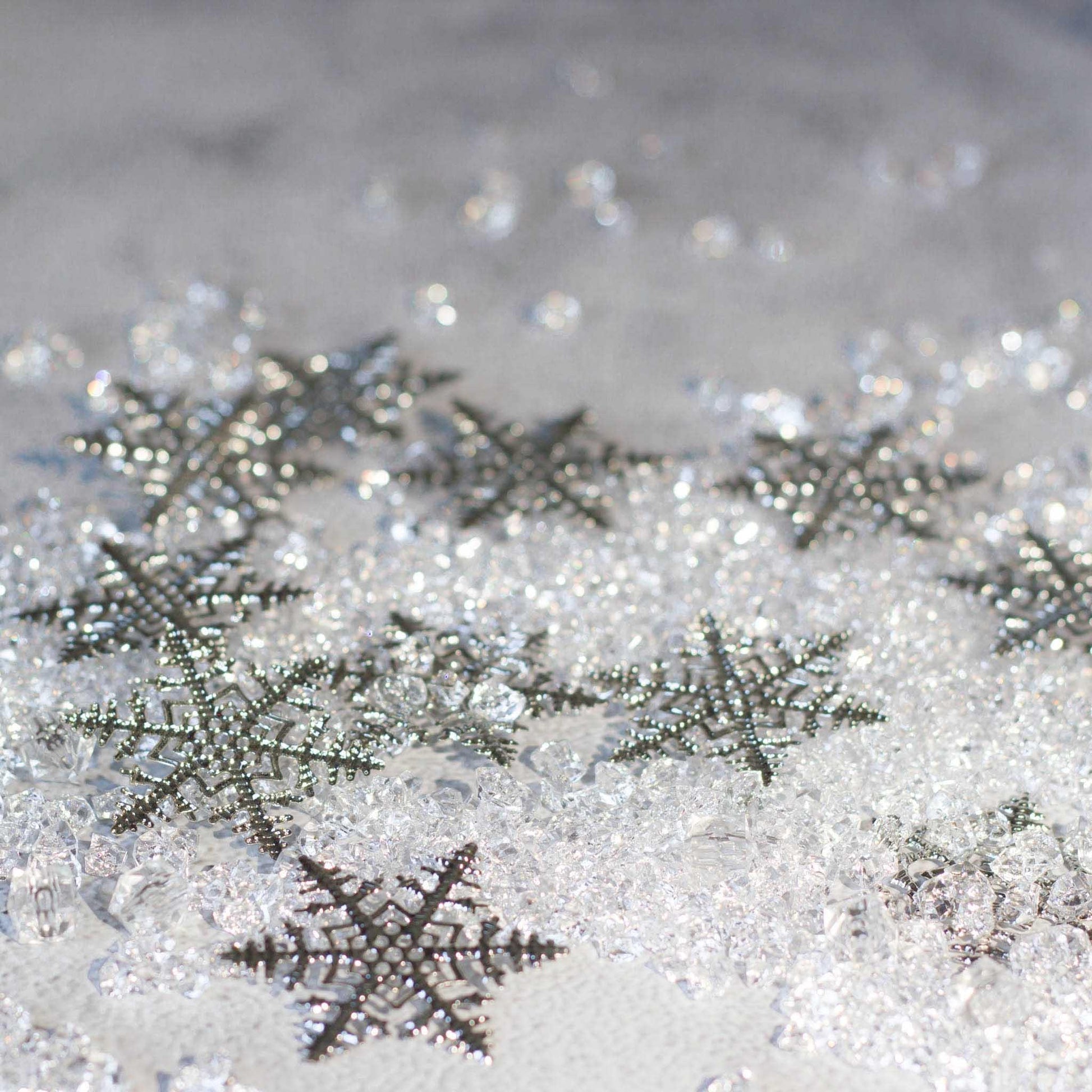Christmas Craft Supplies: Close-up of six intricate silver snowflake filigree metal stampings - Whim5seasons.