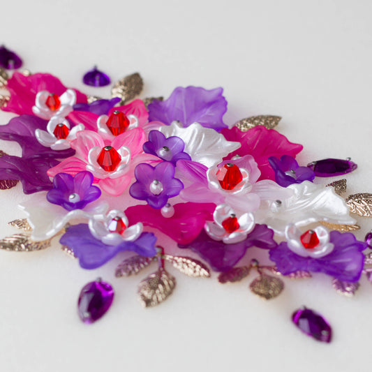 Ornament Supplies - close-up of embellishments, purple and pink, and pearlesque leaves, glass see beads, and gold alloy charms - Whim5seasons.
