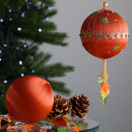 Large 4” beaded ornament kit showing two satin balls - one for an easy DIY Christmas ornament project, and the other is a handmade finished decorative ball with maple leaf charms by Whim5seasons.